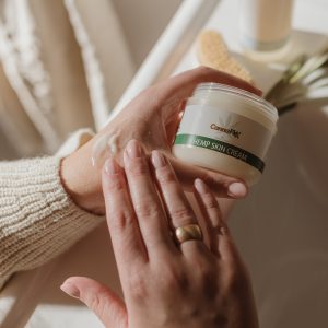 Hands massaging CannaFlex Hemp Skin Cream in to skin